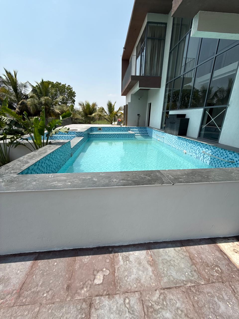 Farmhouse swimming pool and greenery