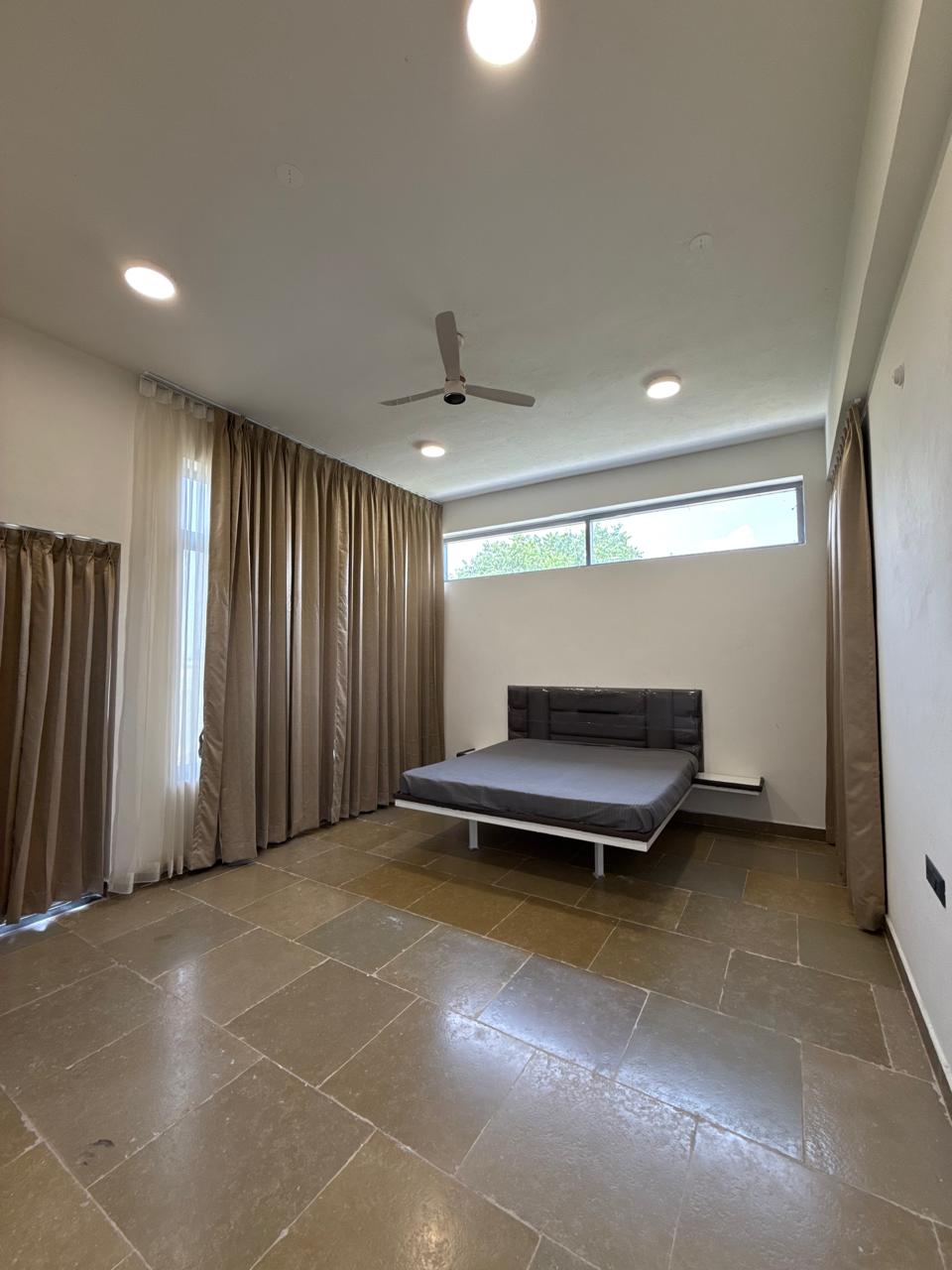 Spacious bedroom with curtain design